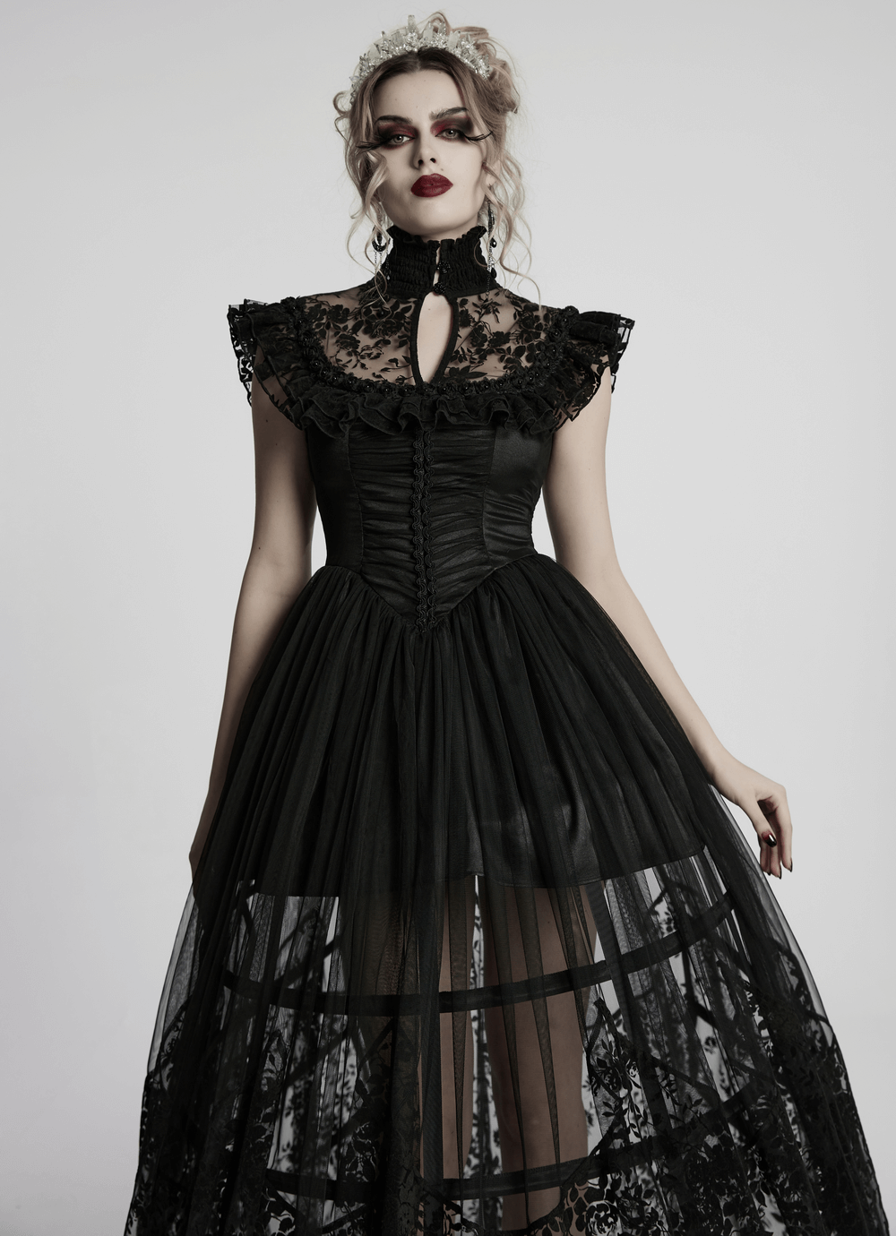 Black lace gothic dress with ruffle sleeves, high neck, and flowing lace skirt, perfect for elegant gothic events.