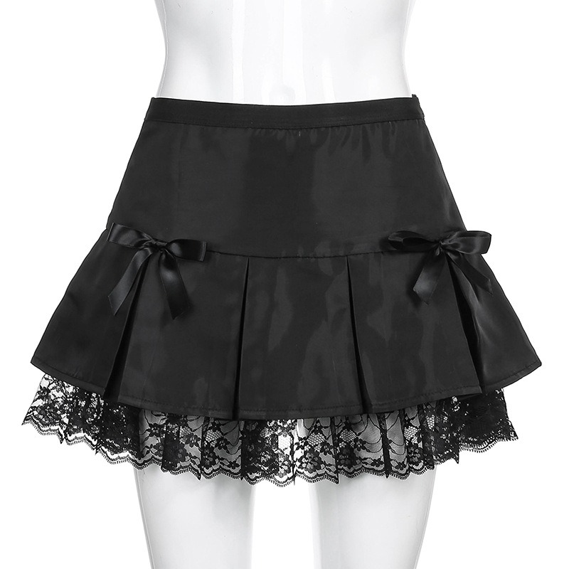Black lace gothic mini skirt featuring pleats and decorative bows, perfect for a stylish wardrobe upgrade.