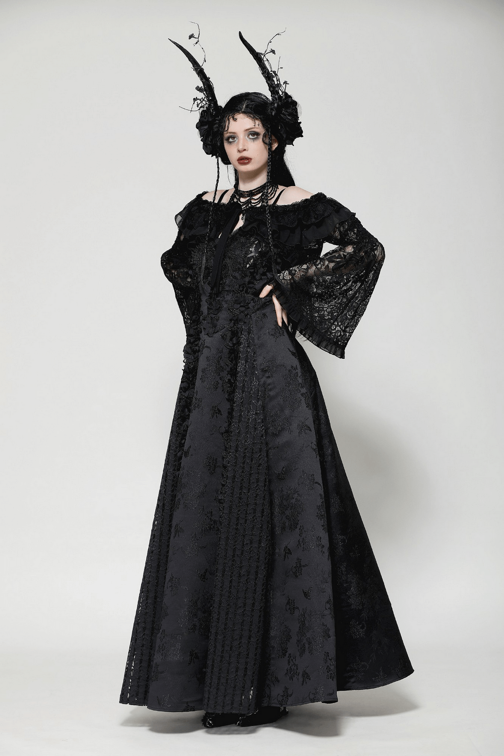 Elegant black lace gothic cape with flared sleeves, perfect for alternative fashion and special occasions.