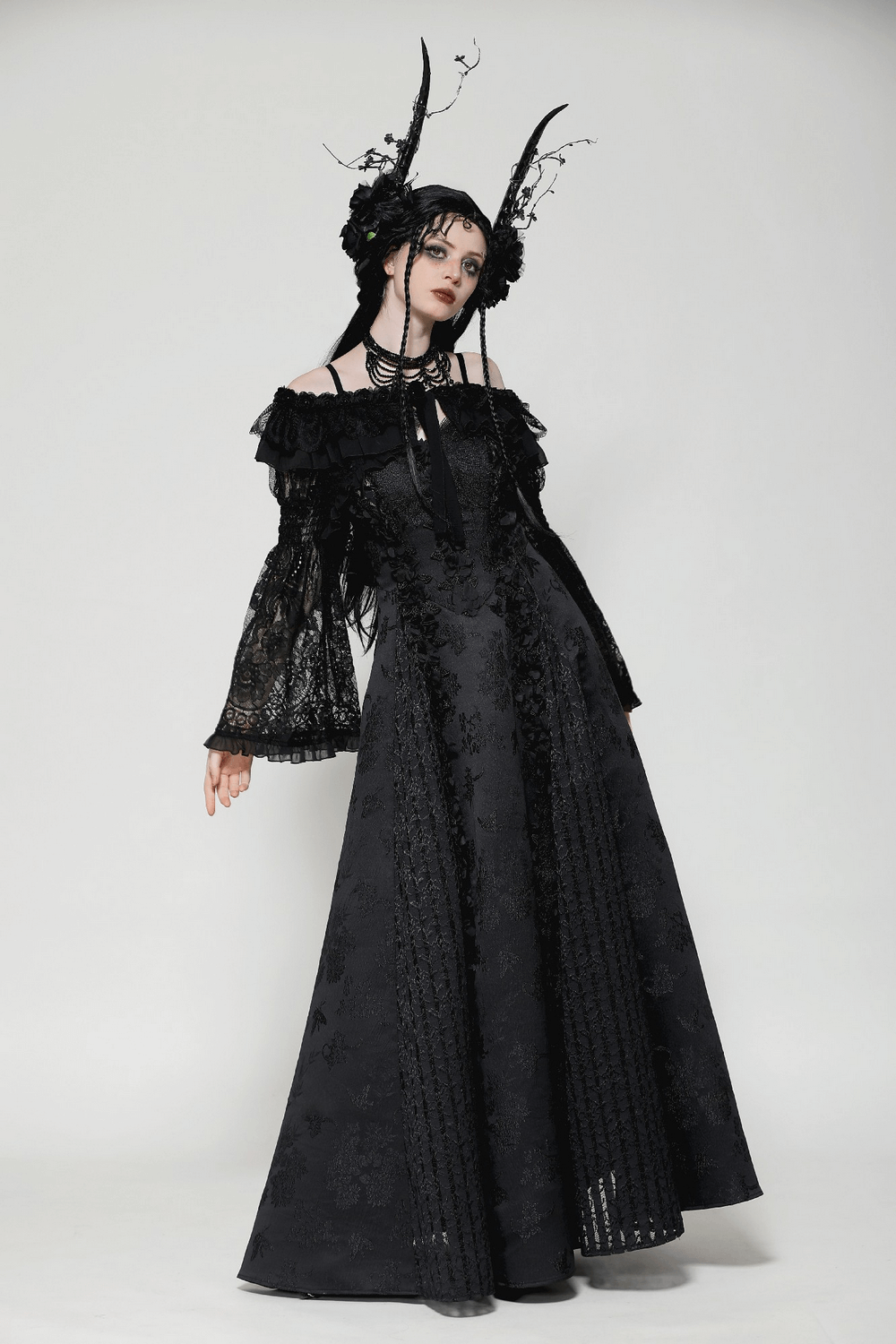 Elegant black lace gothic off-shoulder cape with flared bell sleeves and Victorian-inspired accents. Perfect for alternative fashion.