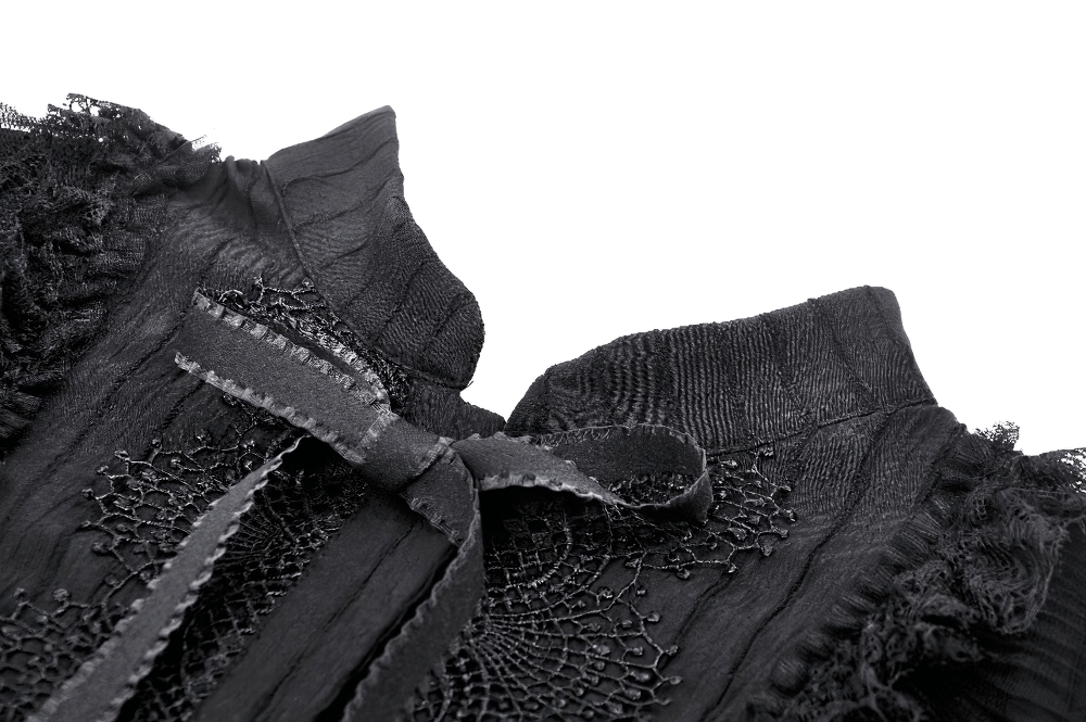 Close-up of the neckline of a black lace gothic dress featuring ribbon detail and intricate lace trim.