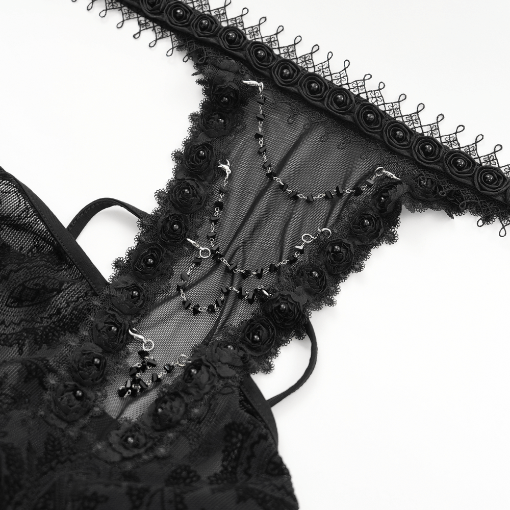 Close-up of black lace gothic top featuring neck chains and floral lace detailing for a Victorian-inspired look.