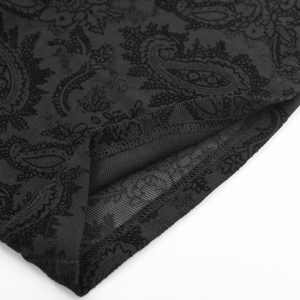 Close-up of intricate black lace fabric with floral patterns, ideal for gothic fashion and Victorian-inspired outfits.