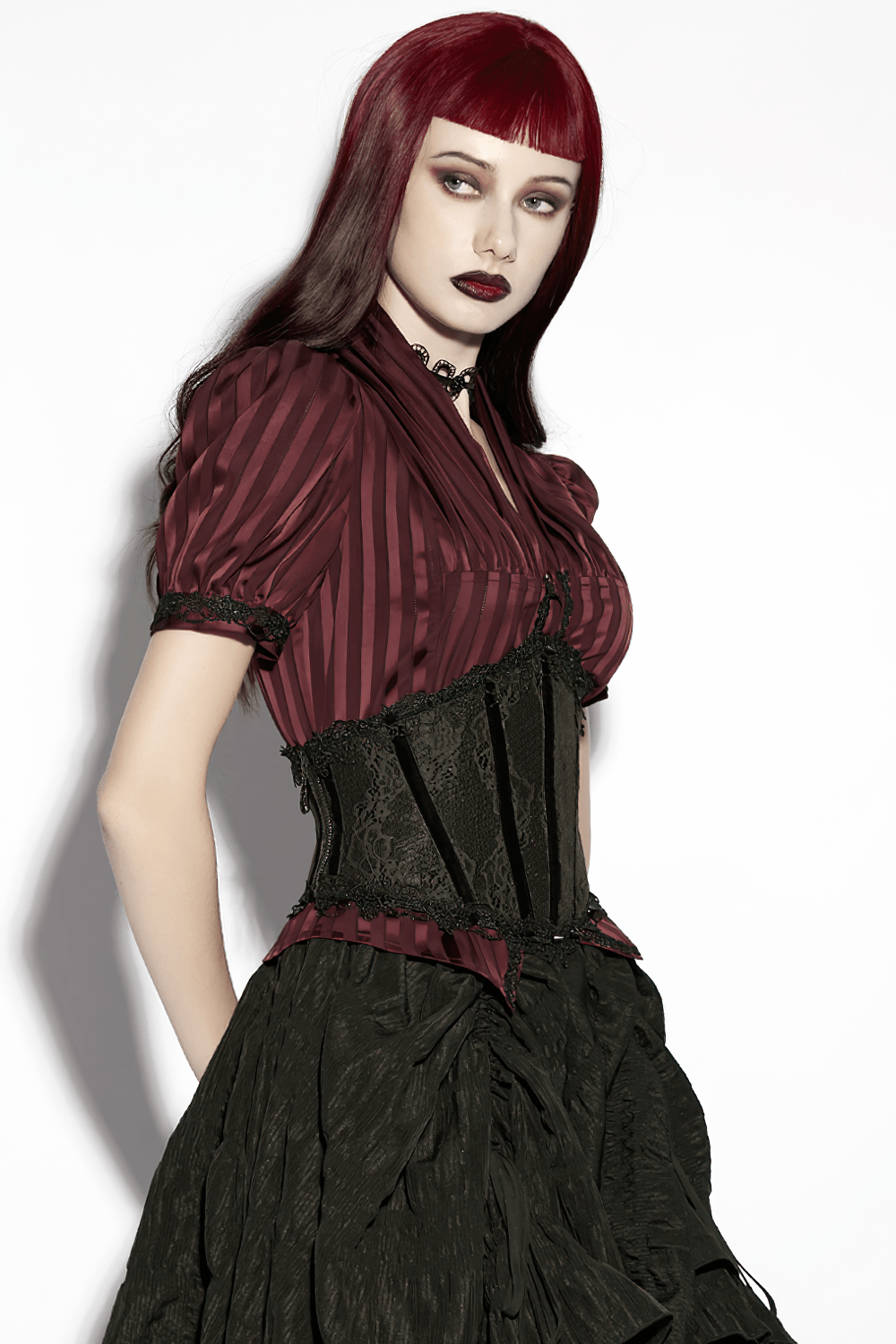 Black Lace Gothic Underbust Waist Cincher Corset worn with a striking red striped blouse and flowing black skirt.