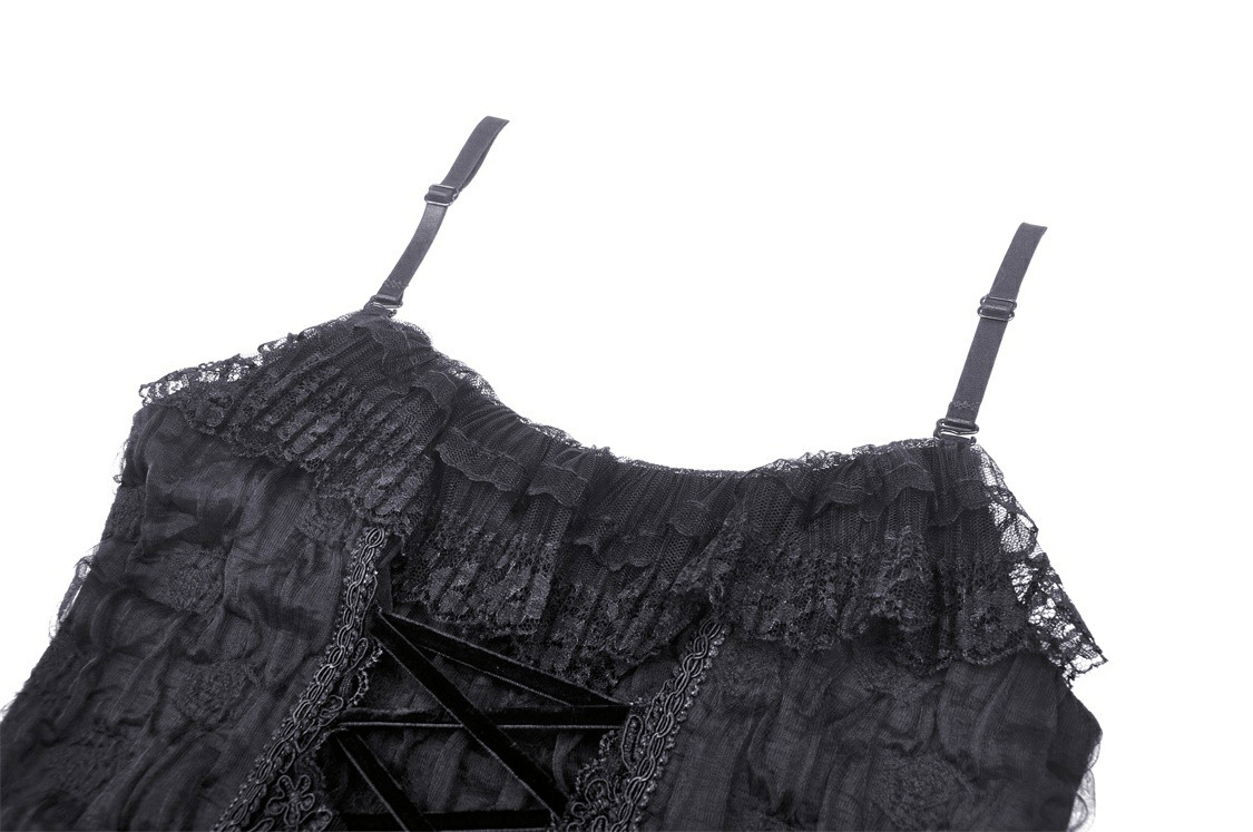 Close-up of a black lace dress with ruffled neckline and halter straps, showcasing its gothic elegance.