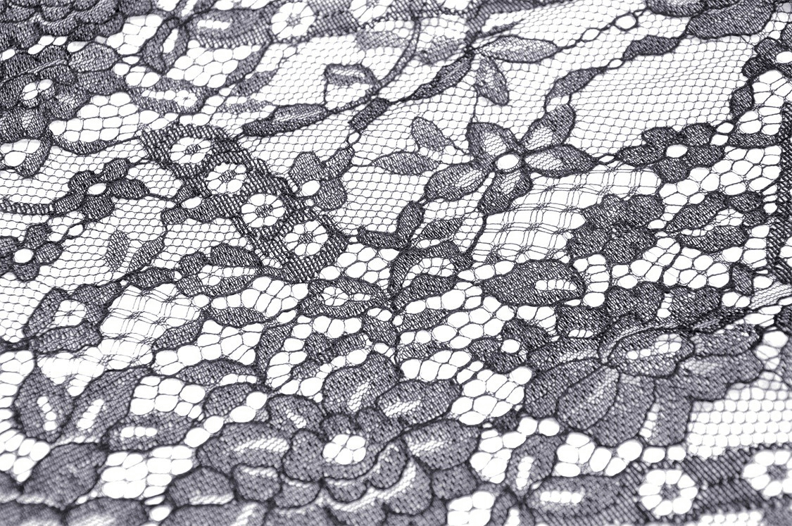 Black lace fabric with floral patterns, perfect for creating a gothic high-low dress with romantic frills.