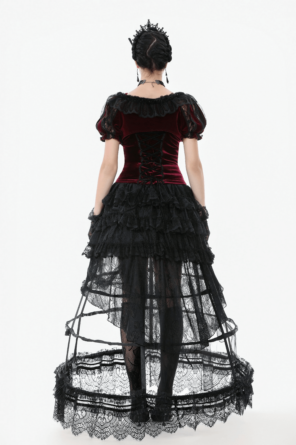 Back view of a gothic high-low skirt with lace and tulle layers, paired with a velvet top for an edgy vintage look.