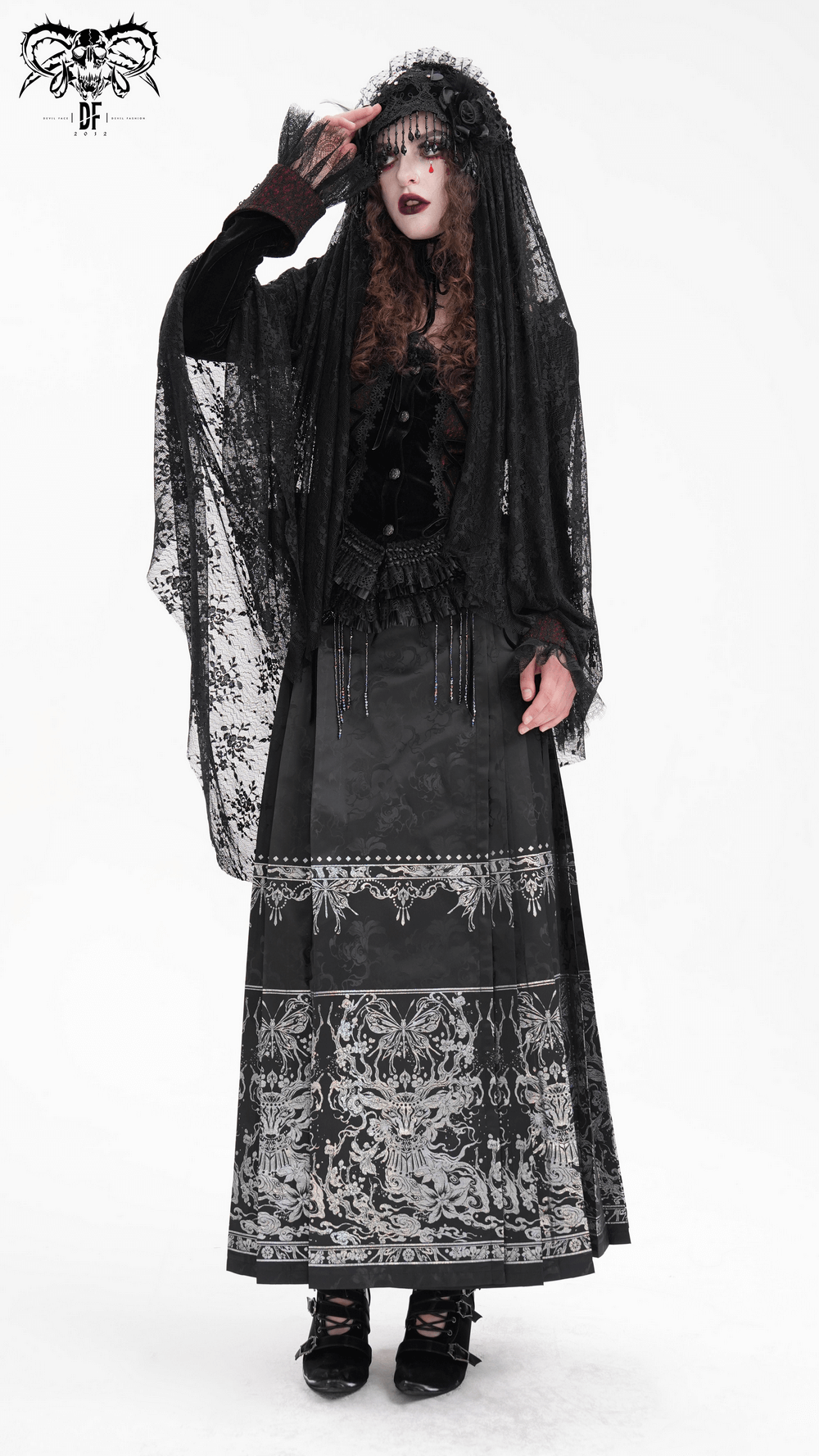 Gothic woman in black lace long veil and stylish dark fashion outfit, embodying elegance and mystery.