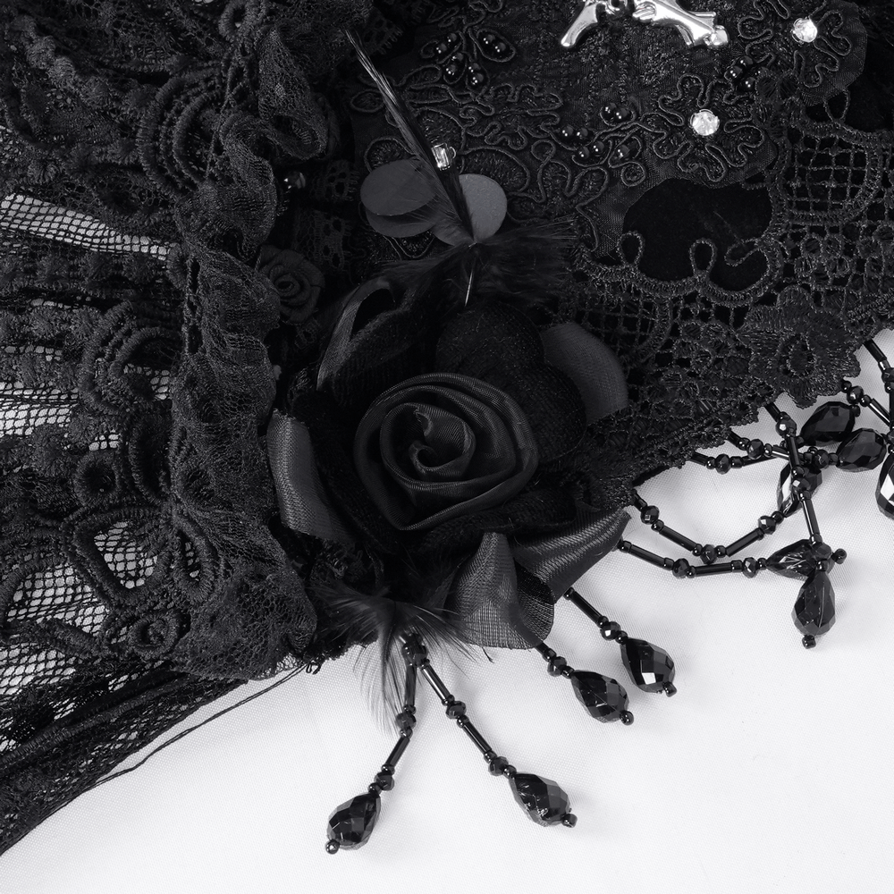 Close-up of a black lace veil featuring intricate lace, a decorative rose, and elegant beading for gothic fashion.