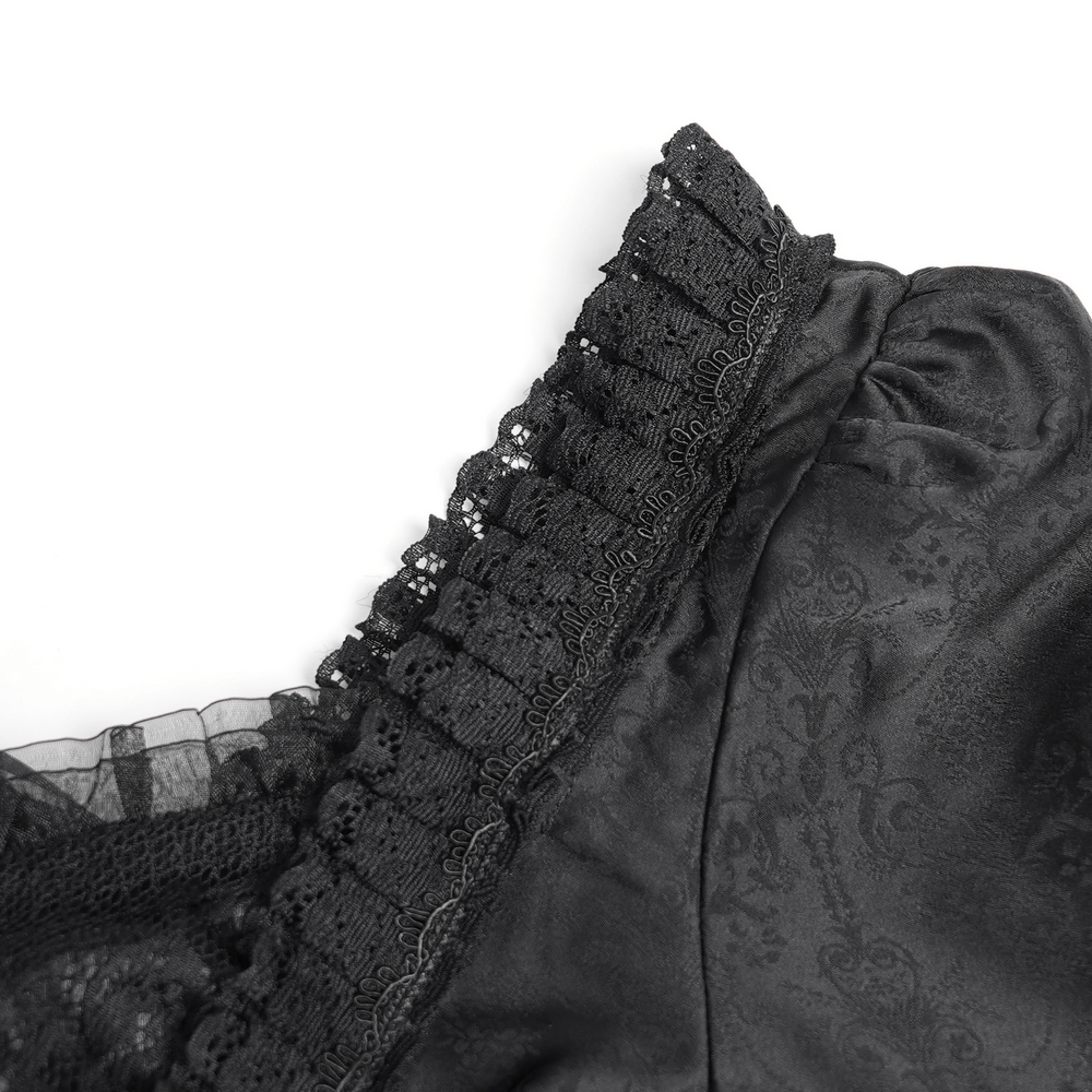 Close-up of the elegant black lace detailing and ruffled trim on a gothic medieval style dress.
