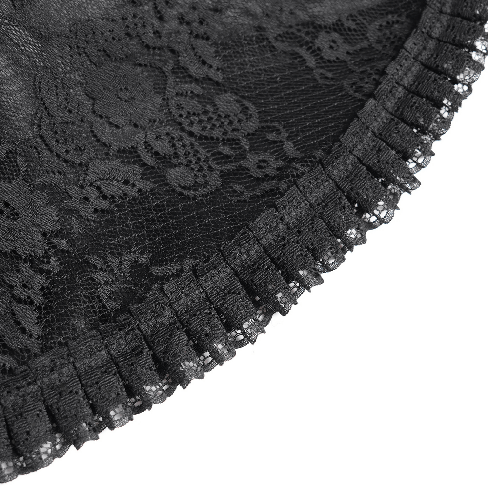 Close-up of black lace fabric with ruffled trim, showcasing the intricate design for a gothic dress.