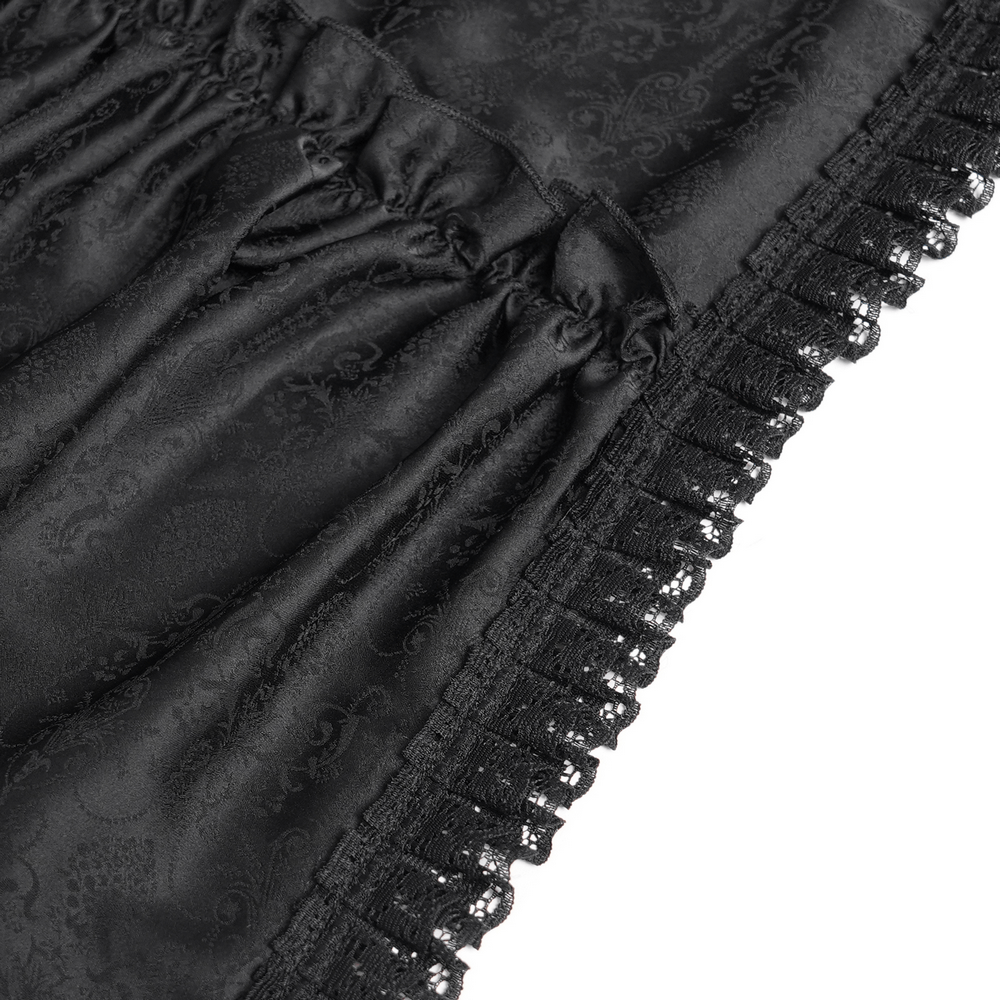 Close-up view of black lace trim and gathered fabric on a gothic dress, showcasing elegant Victorian details.