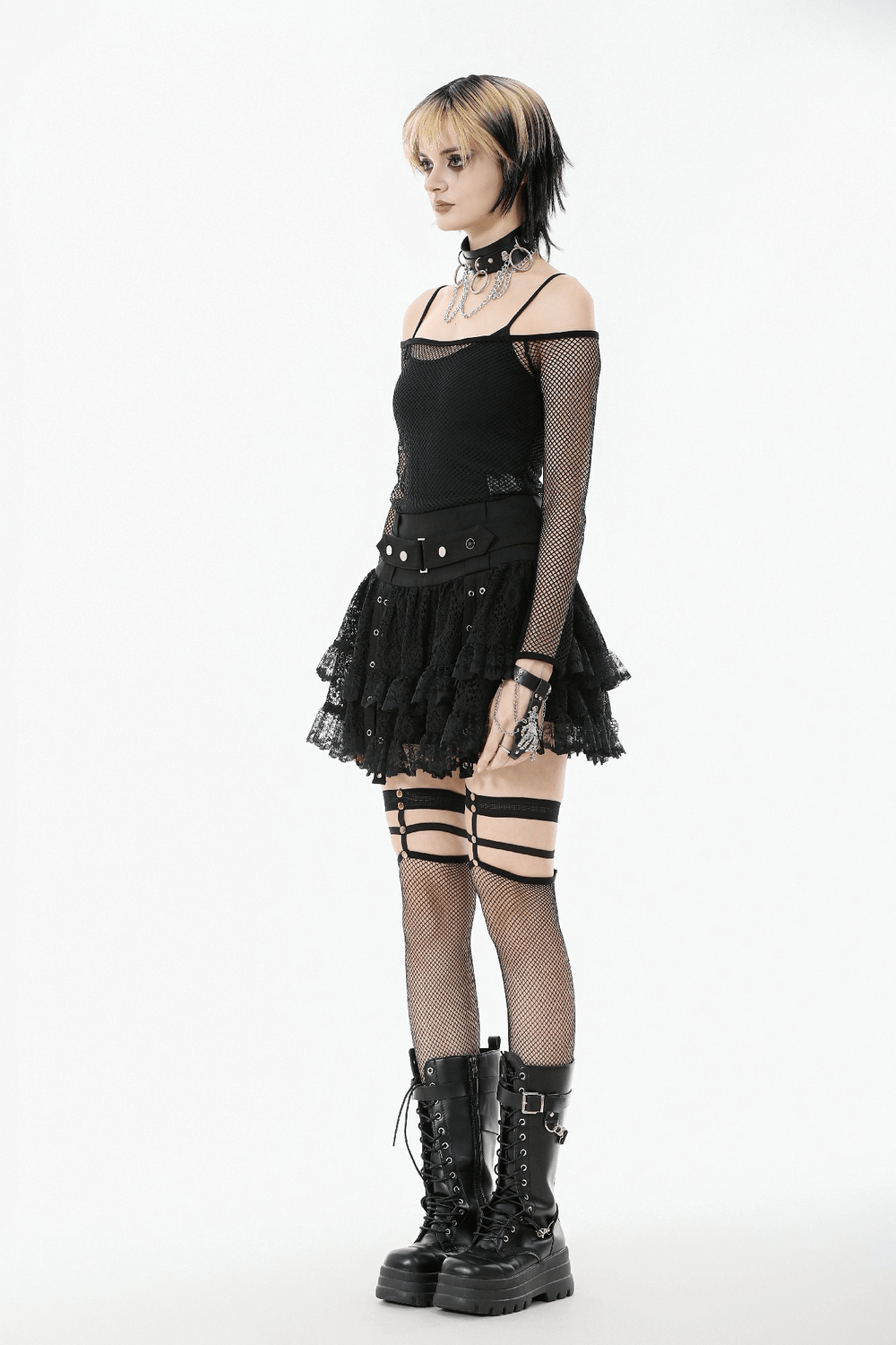 Black Lace Mini Skirt with Straps and Layered Ruffles worn by a model with gothic accessories and black combat boots.