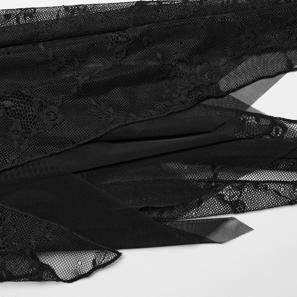 Close-up of black lace fabric with floral patterns, showcasing the delicate texture and elegance for a stunning dress design.
