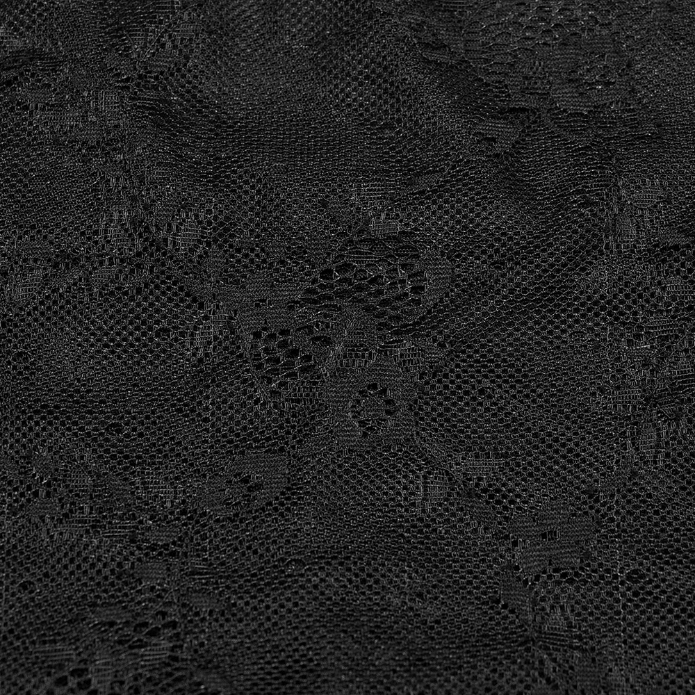 Close-up of exquisite black lace fabric featuring intricate patterns, perfect for a stylish dress.