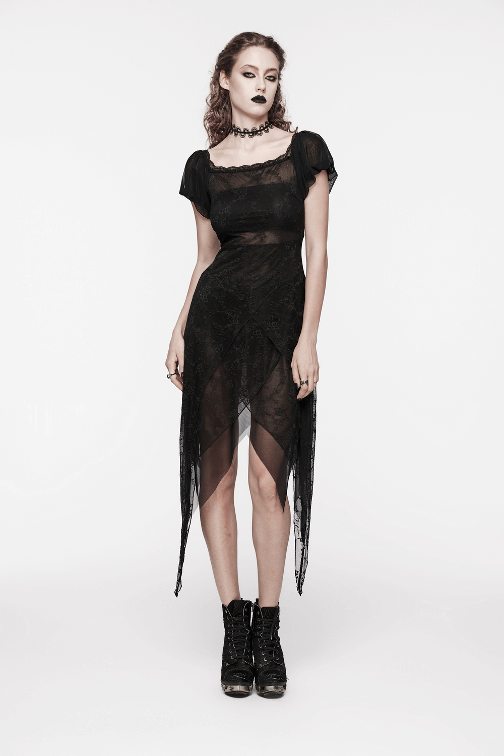 Alluring black lace off-shoulder dress with spiky detailing, featuring whimsical puff sleeves and edgy ankle boots.