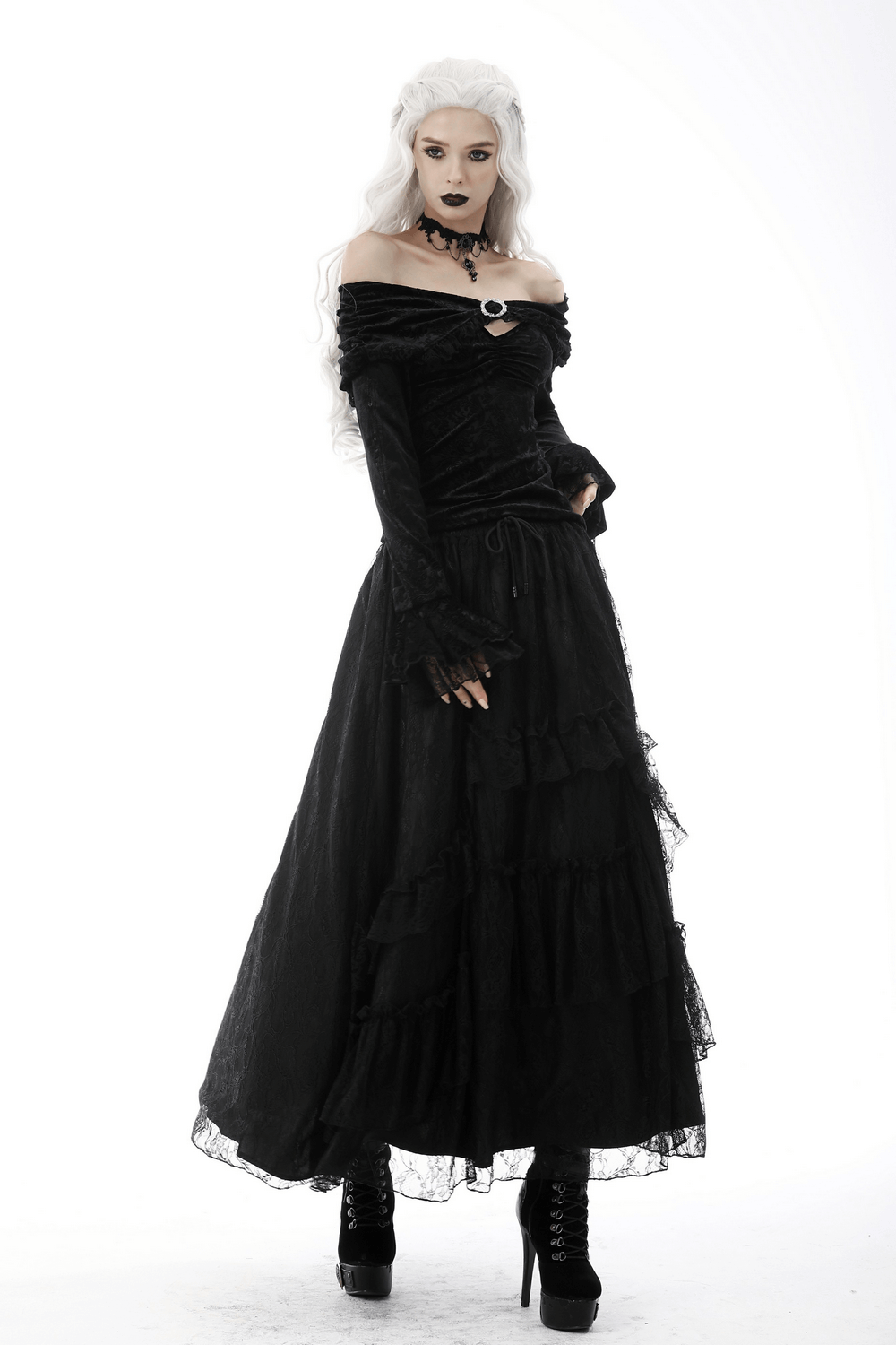 Victorian-inspired black lace off-shoulder top with brooch, flared lace cuffs, and gothic elegance.