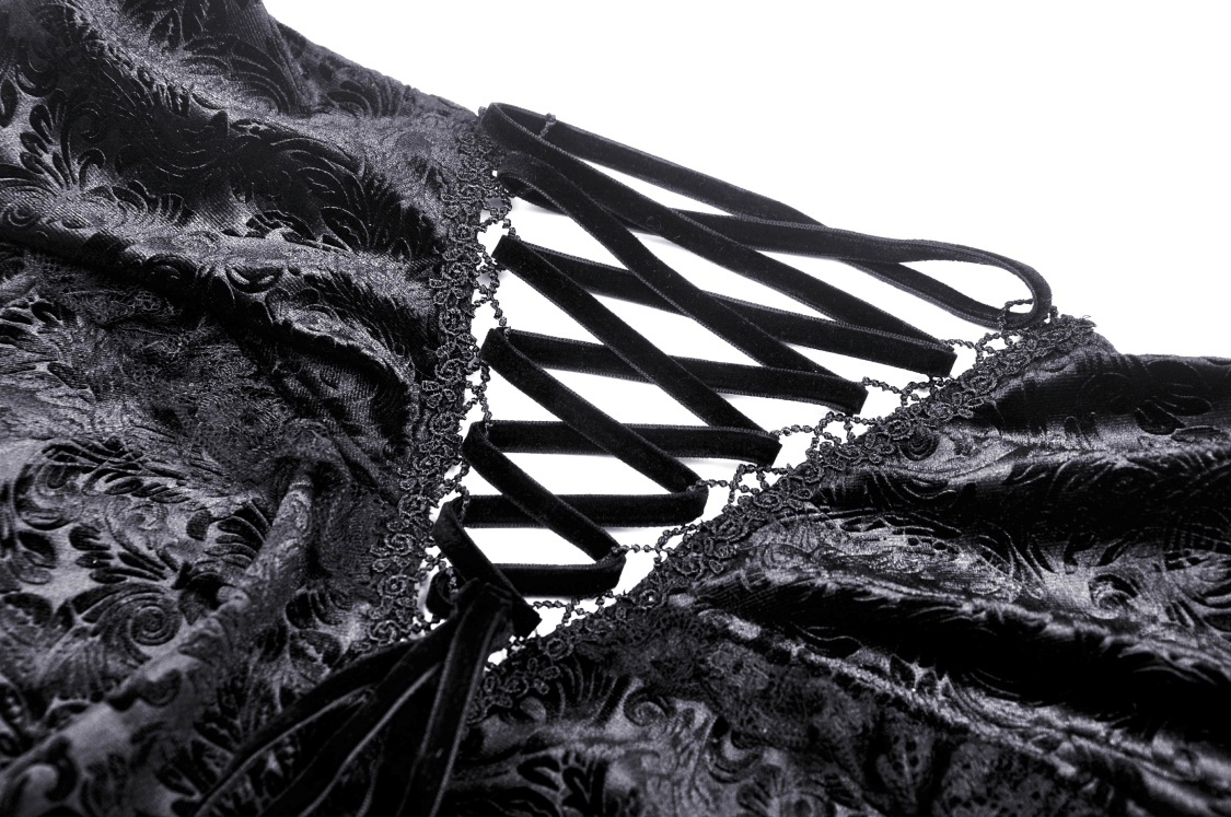 Close-up of black velvet lace-up detailing on a gothic off-shoulder top for elegant evening wear.