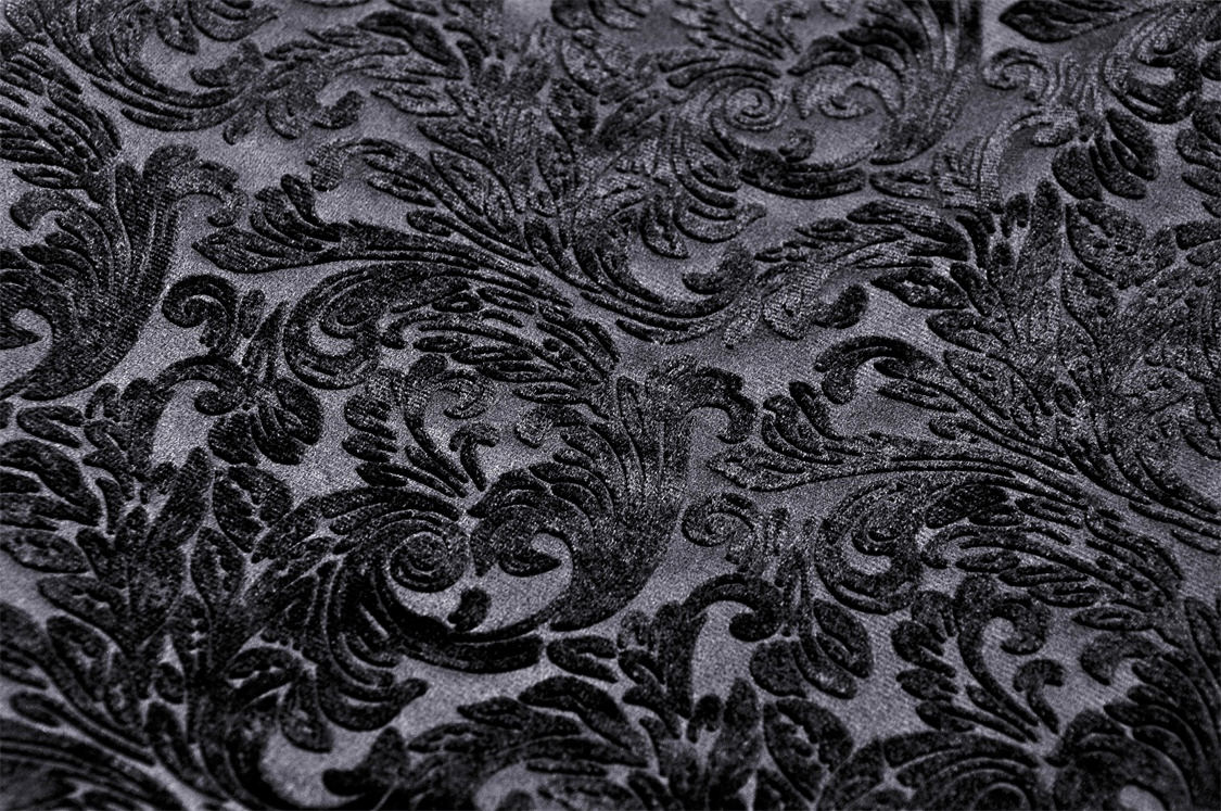 Elegant black velvet fabric with intricate swirling floral patterns, perfect for Gothic-inspired fashion.