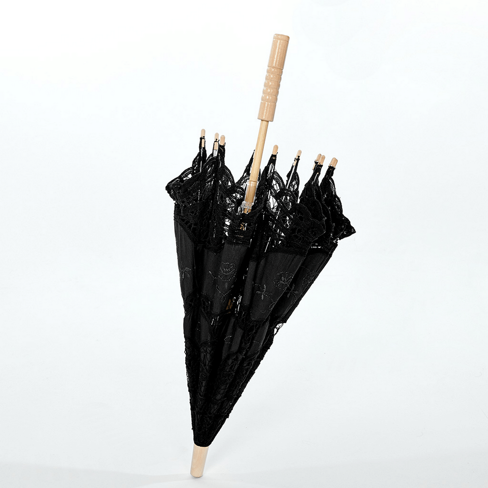 Black lace parasol with elegant embroidery and wooden handle, perfect for gothic outfits and romantic photoshoots.