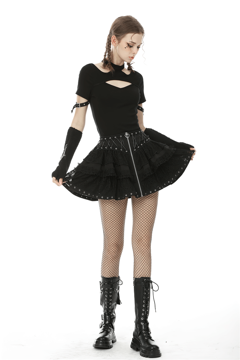 Gothic black lace ruffled skirt with heart lacing, zip closure, and stylish outfit featuring fishnet tights and combat boots.