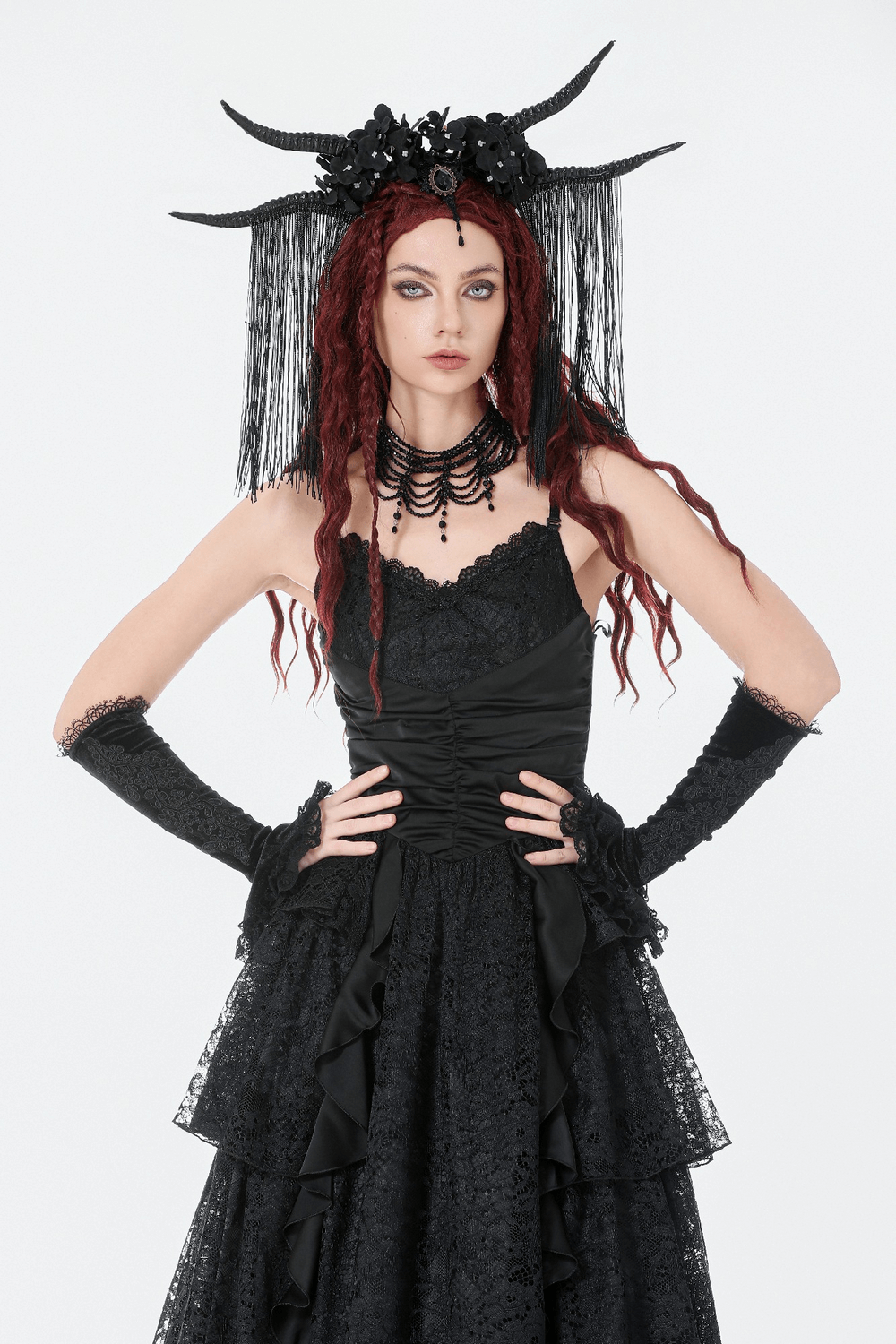 Black Lace Ruffled Tiered Gothic Dress with Spaghetti Straps worn by model with accessories and dramatic hairstyle.