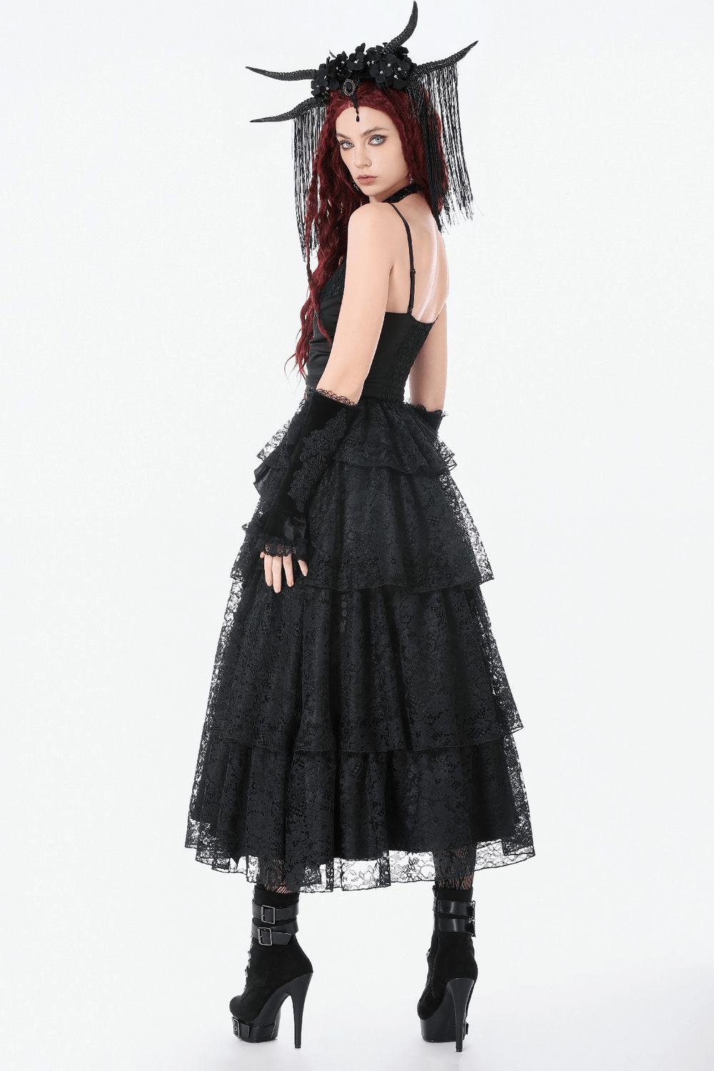 Model wearing a Black Lace Ruffled Tiered Gothic Dress with Spaghetti Straps, featuring intricate lace and a gothic style.