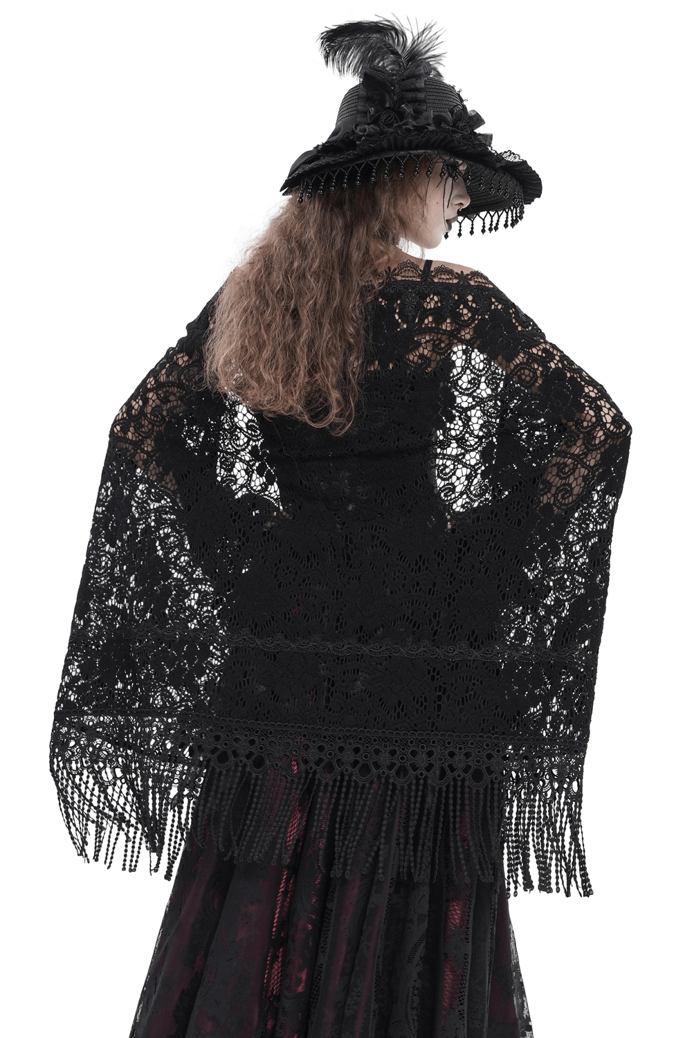 Black Lace Shawl with Fringed Hem for Gothic and Boho Style worn over a black dress with a matching hat.