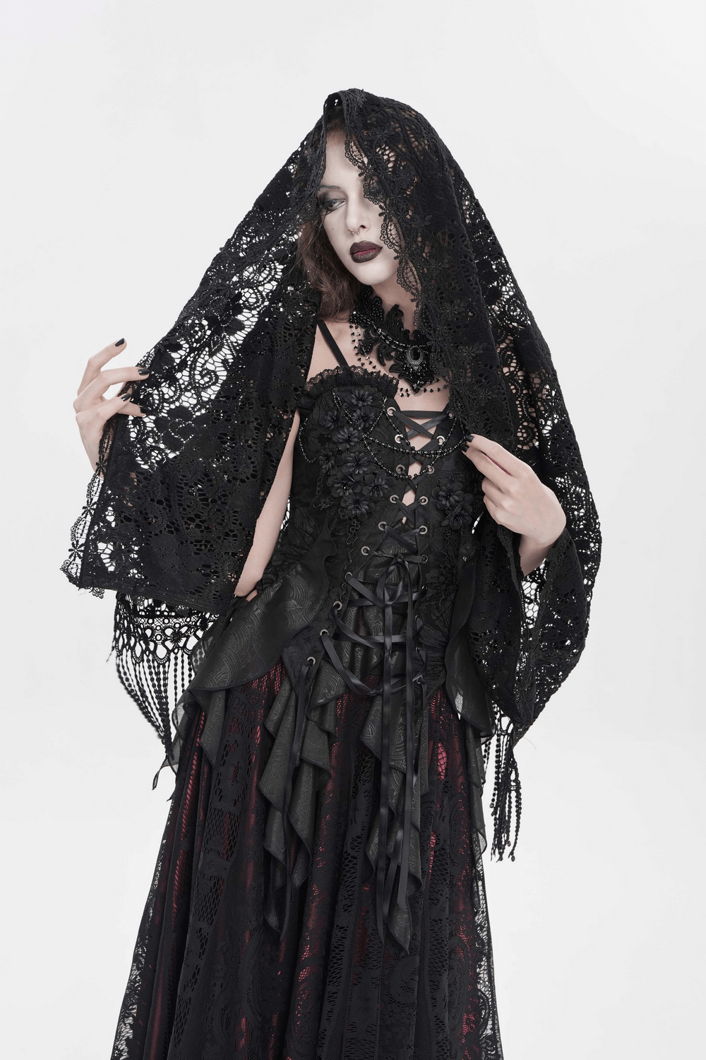 Black Lace Shawl with Fringed Hem for Gothic and Boho Style worn by model, showcasing intricate lace design.