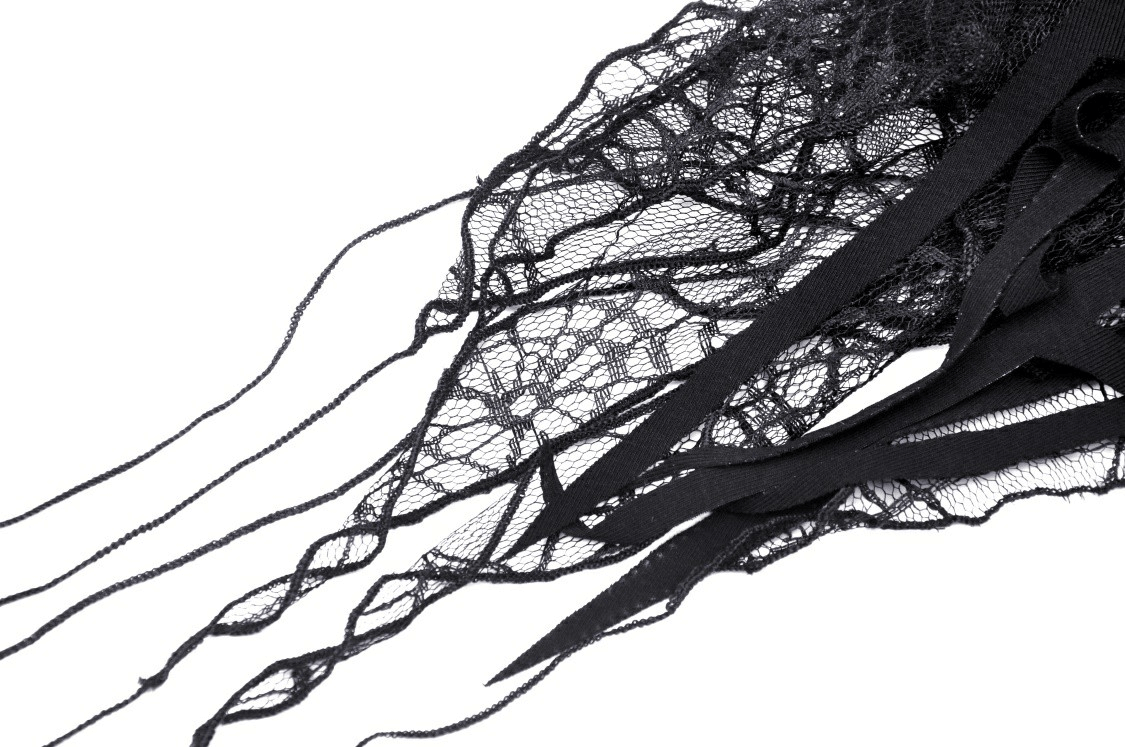 Close-up of intricate black lace featuring delicate spiderweb patterns, perfect for gothic fashion.