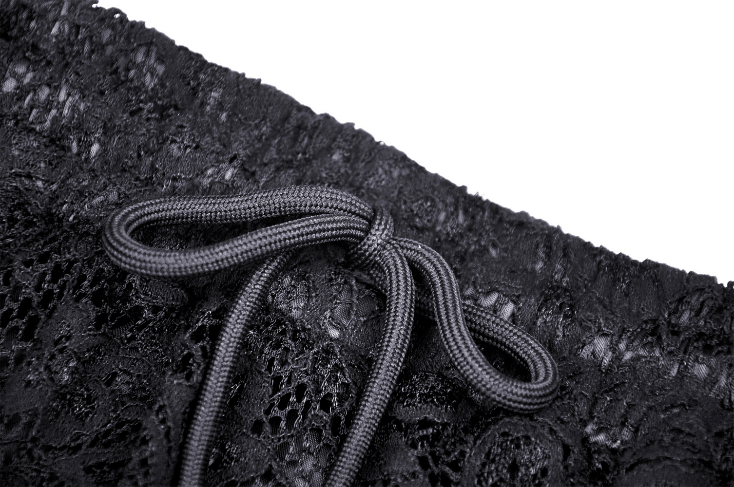 Close-up of black lace tiered skirt showing frills and drawstring detail for stylish flair.