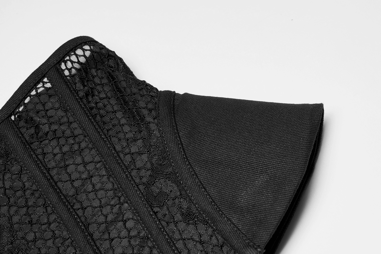 Black lace-up cincher corset showcasing elegant mesh panels and structured design detail.