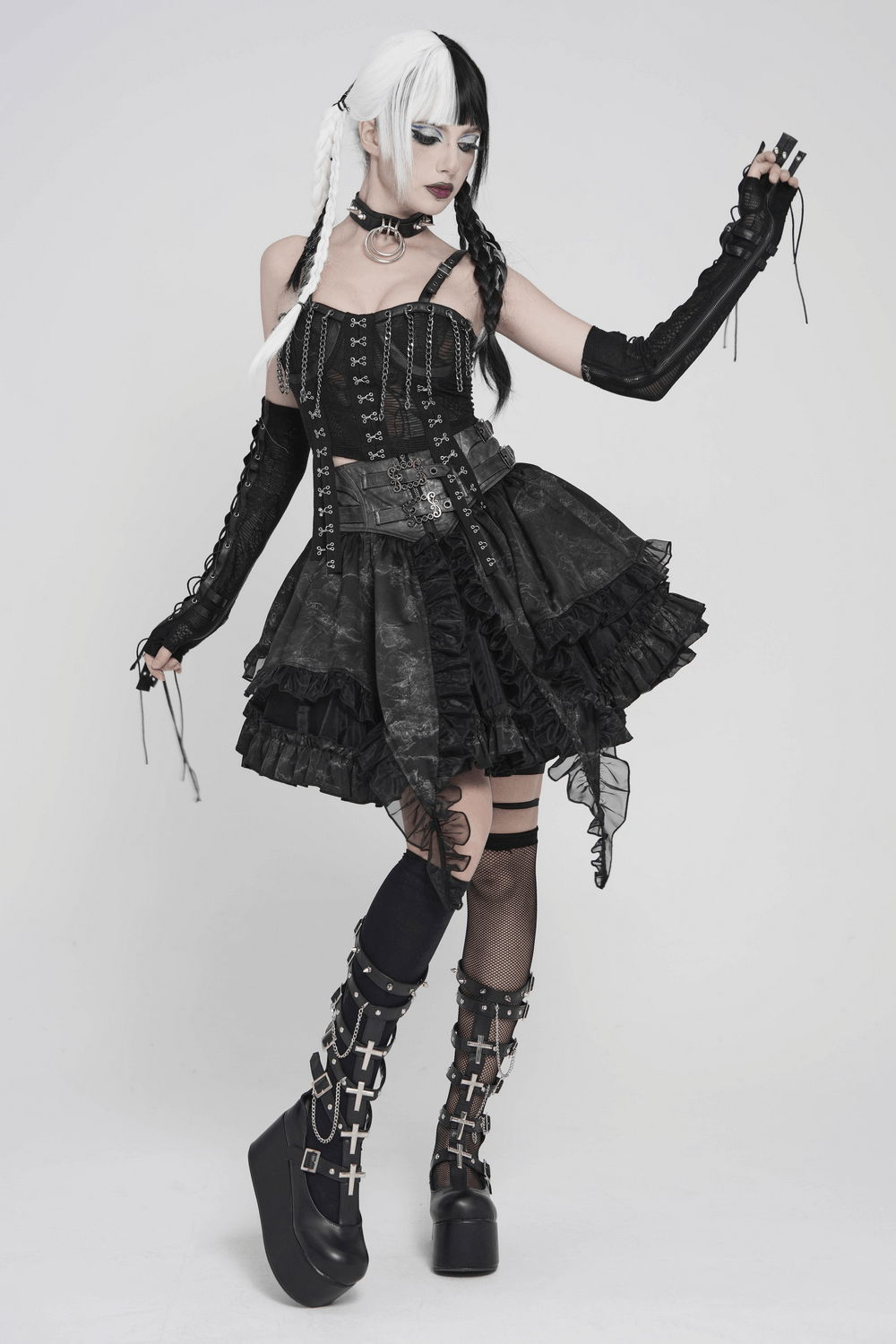Black Lace-Up Gothic Arm Warmers with Mesh Panels worn by a model in a stylish black dress.