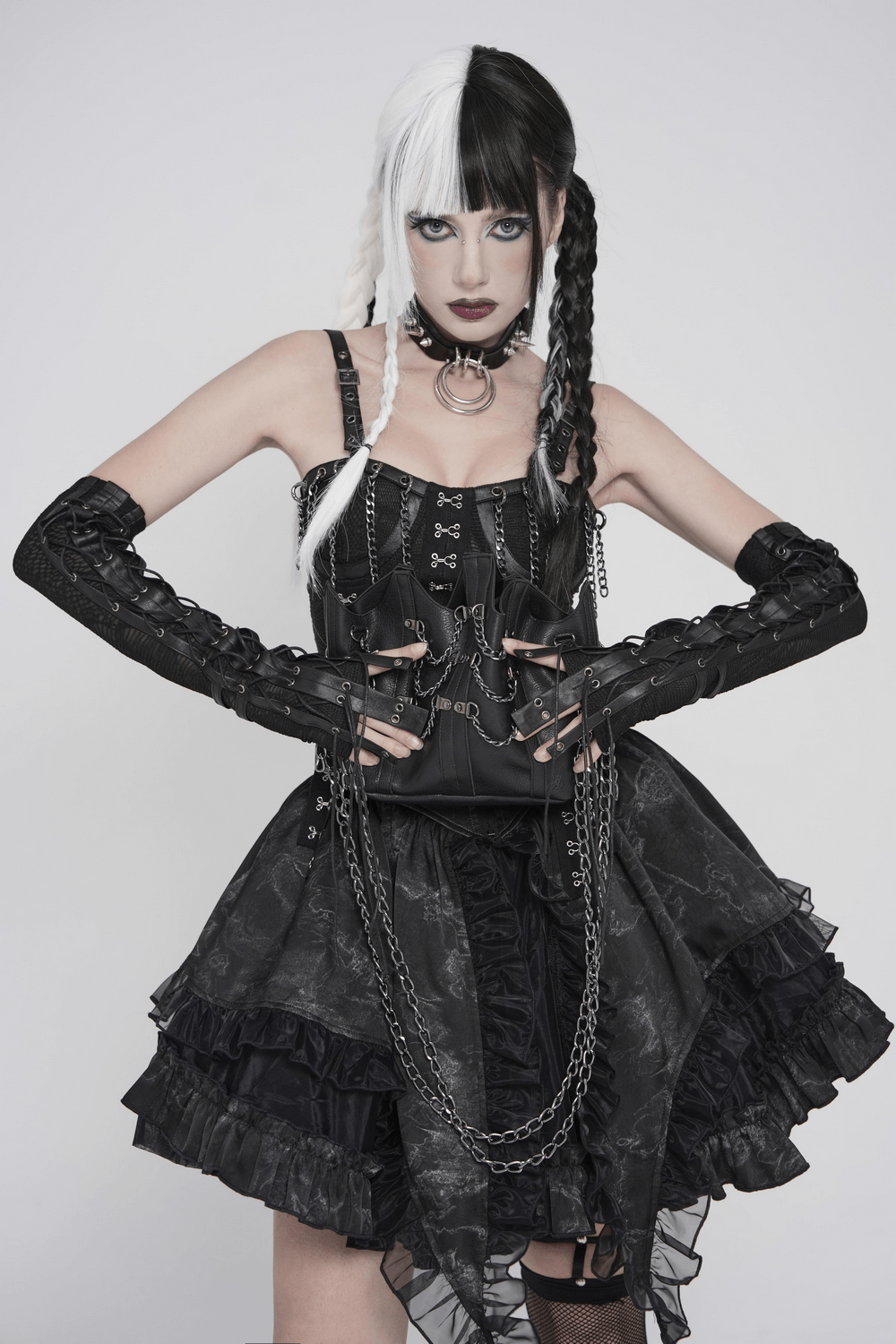 Black Lace-Up Gothic Arm Warmers with Mesh Panels worn by a model showcasing a gothic fashion look.