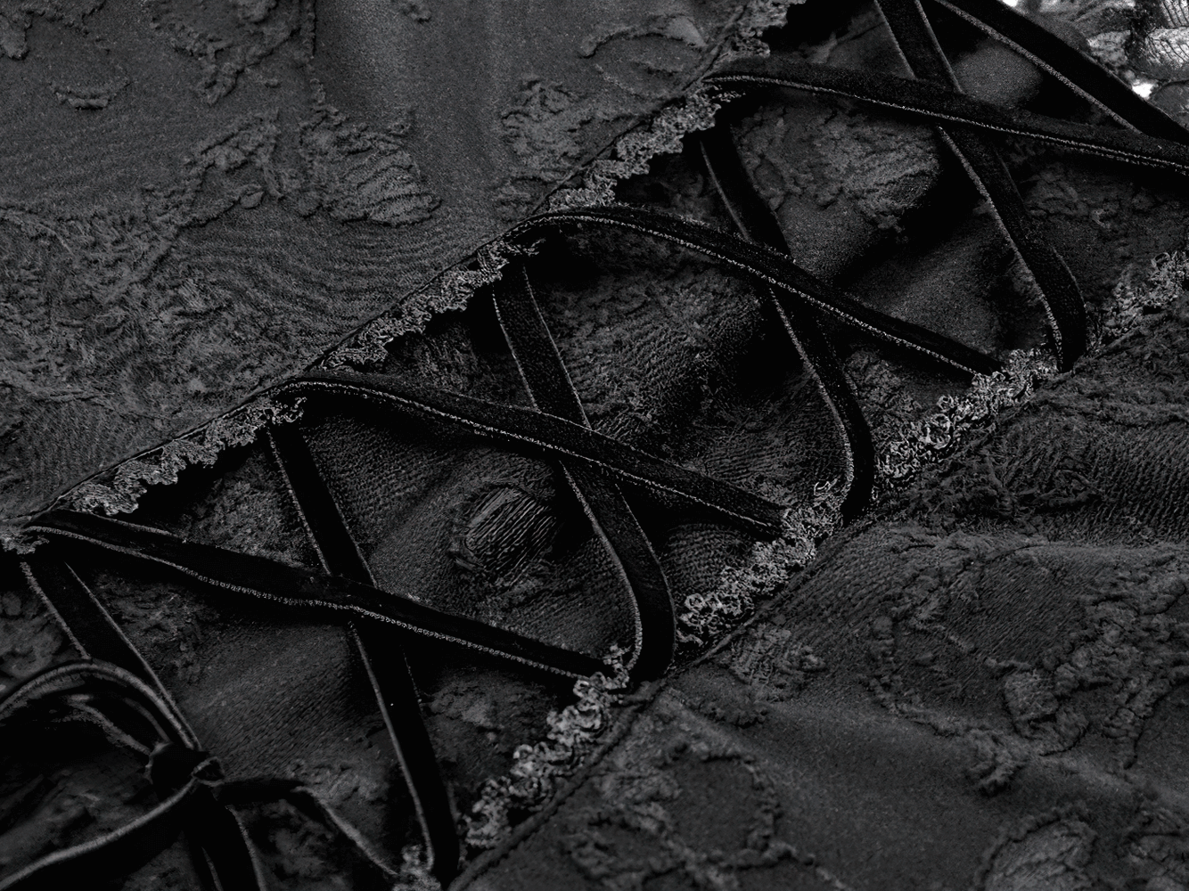 Black Lace-Up Gothic Mini Dress with Bell Sleeves close-up of lace detailing and corset-style lacing