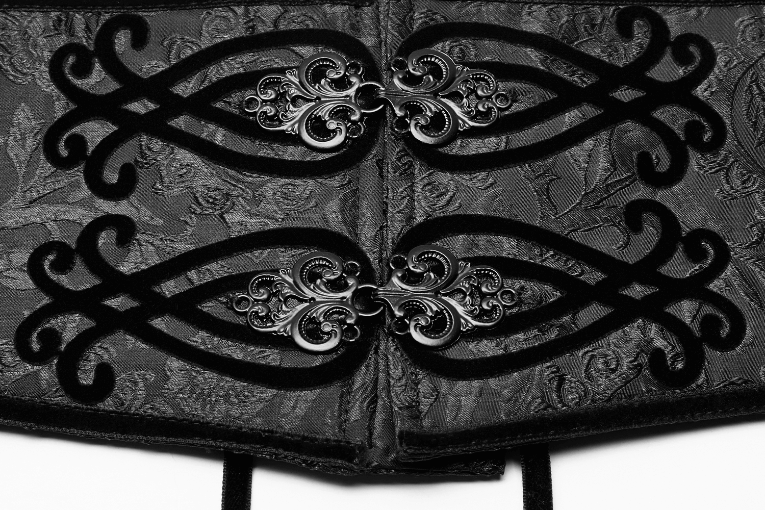 Close-up of black lace-up jacquard corset belt with ornate metal buckle details, showcasing elegant design and texture.