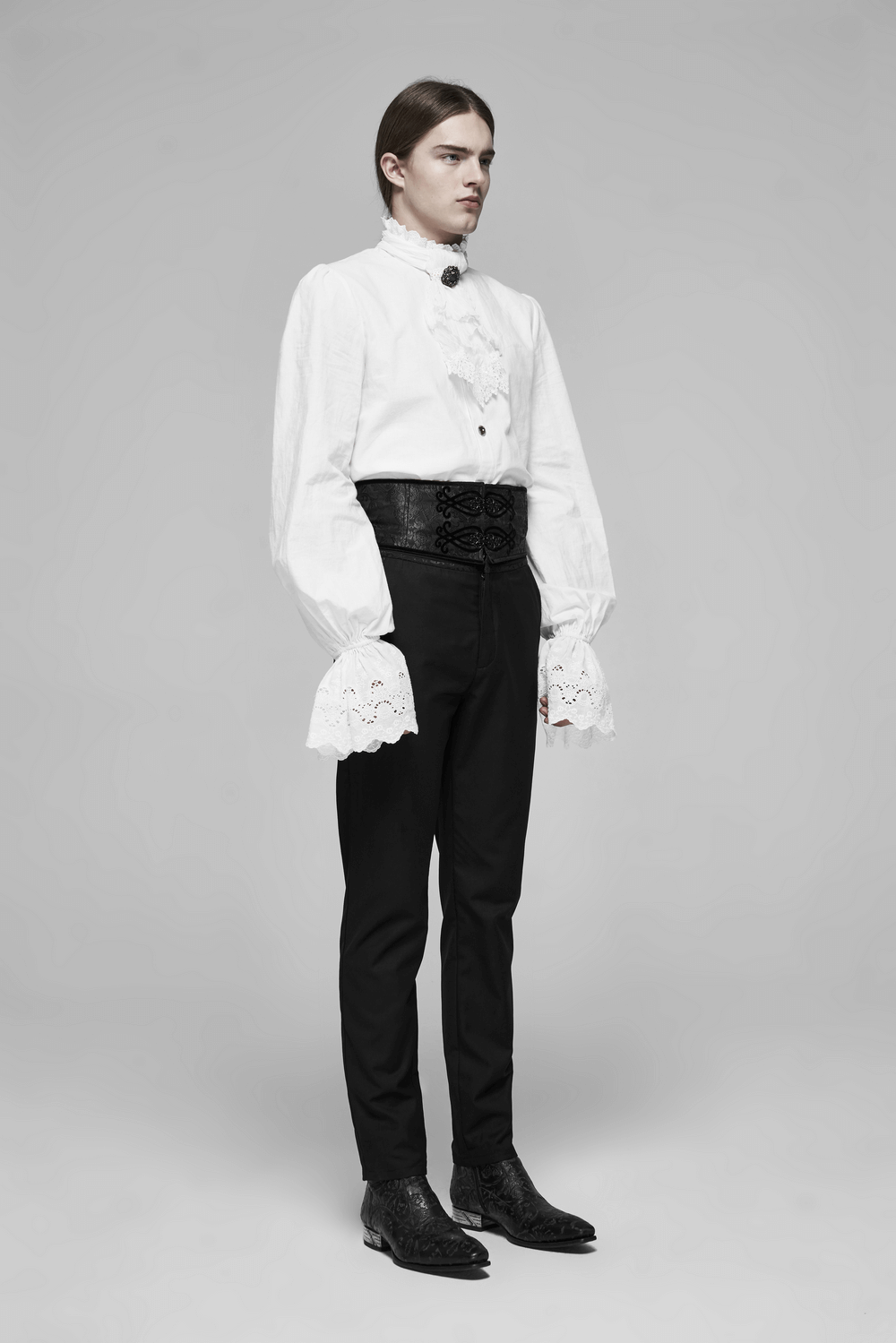 Elegant model wearing a black lace-up jacquard corset belt with metal buckle, styled with a white shirt and black pants.