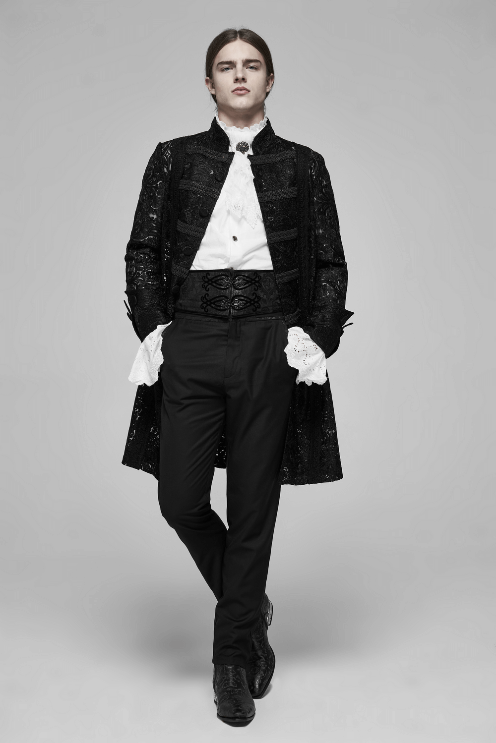 Model showcasing a black lace-up jacquard corset belt with metal buckle, paired with an elegant coat and stylish trousers.