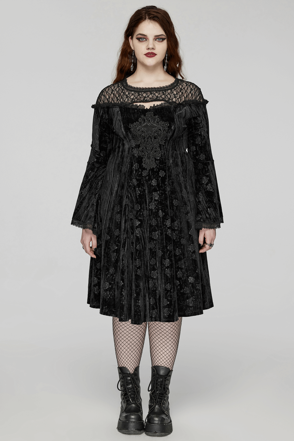 Victorian-inspired black velvet roses dress with lace, trumpet sleeves, and fishnet stockings for gothic elegance.