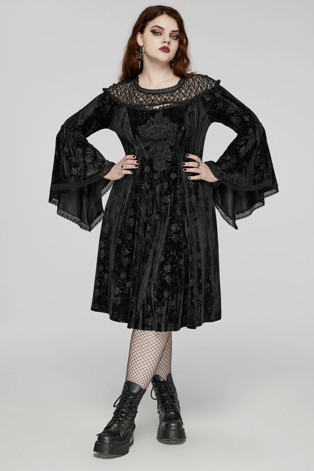Victorian inspired black lace velvet dress with trumpet sleeves and floral details, showcasing gothic elegance.