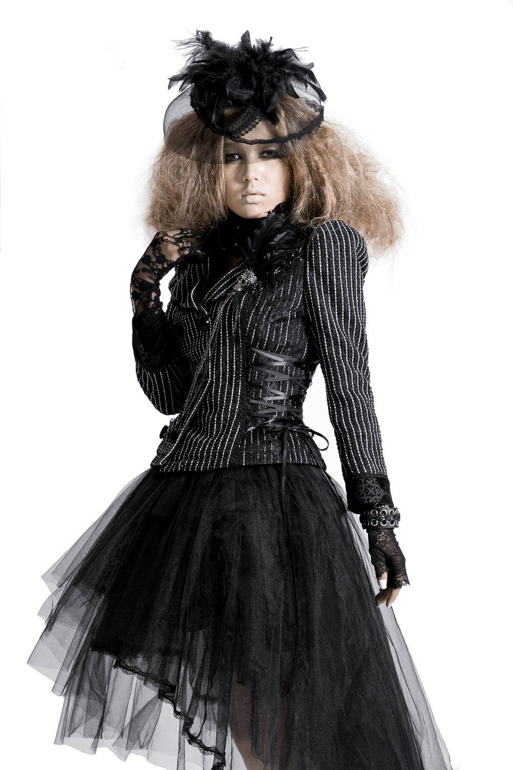 Model in black lace Victorian-style dress and gloves, exuding elegance and edgy fashion vibes.