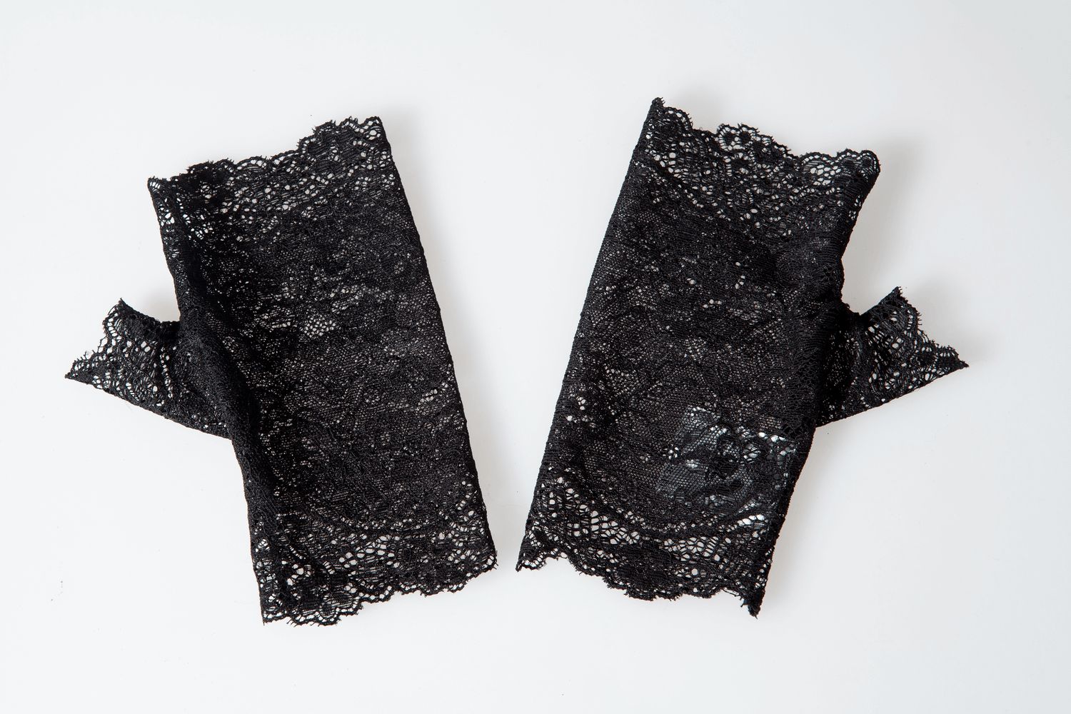 Elegant black lace Victorian-inspired gloves, perfect for adding sophistication to any fashionable outfit.