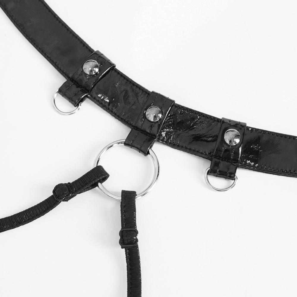 Close-up of a black vinyl choker with ring detail and adjustable straps for a gothic fashion statement.