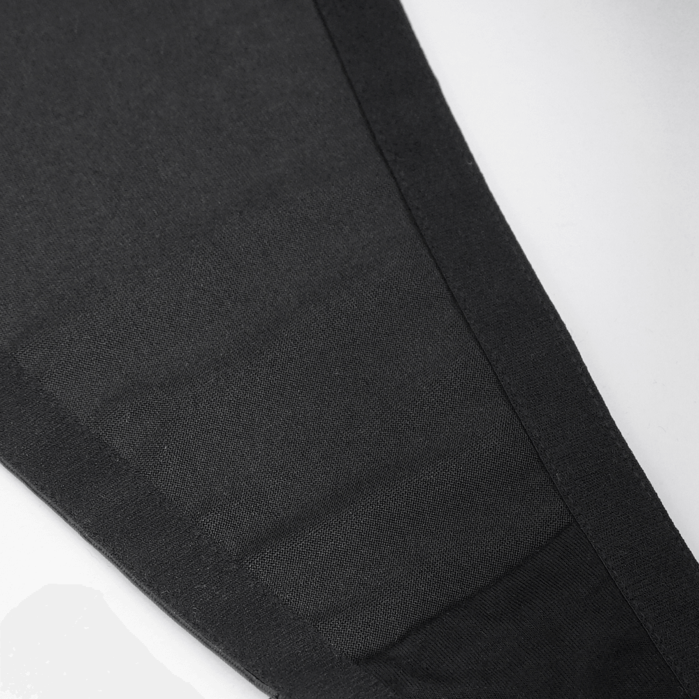 Close-up of black leggings showcasing smooth fabric and tailored fit for a stylish, comfortable look.