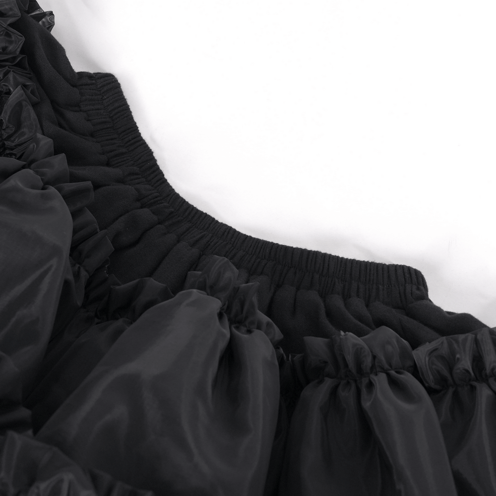 Close-up of the elastic waistband and layered ruffles of a black Gothic Lolita tulle skirt for women.