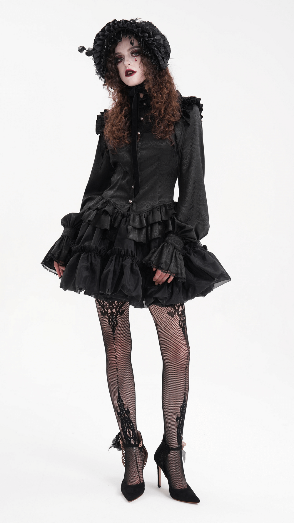 Gothic Lolita model wearing a black ruffled dress, hat, and lace tights, embodying vintage dark fashion.