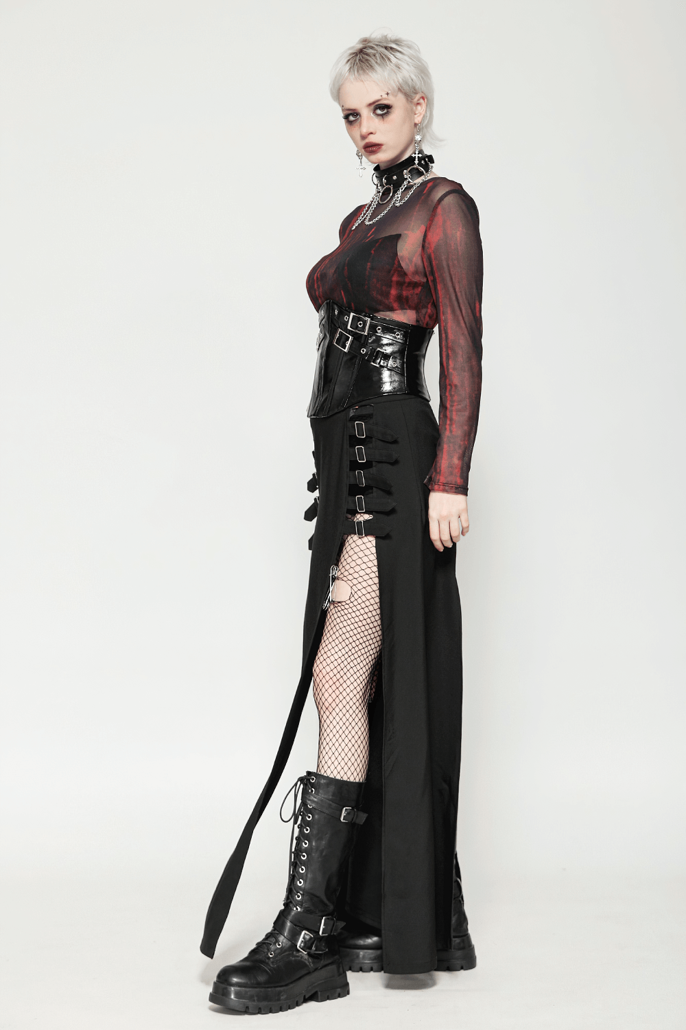 Model showcasing a black leather corset belt with buckles, styled with edgy fashion and bold accessories.