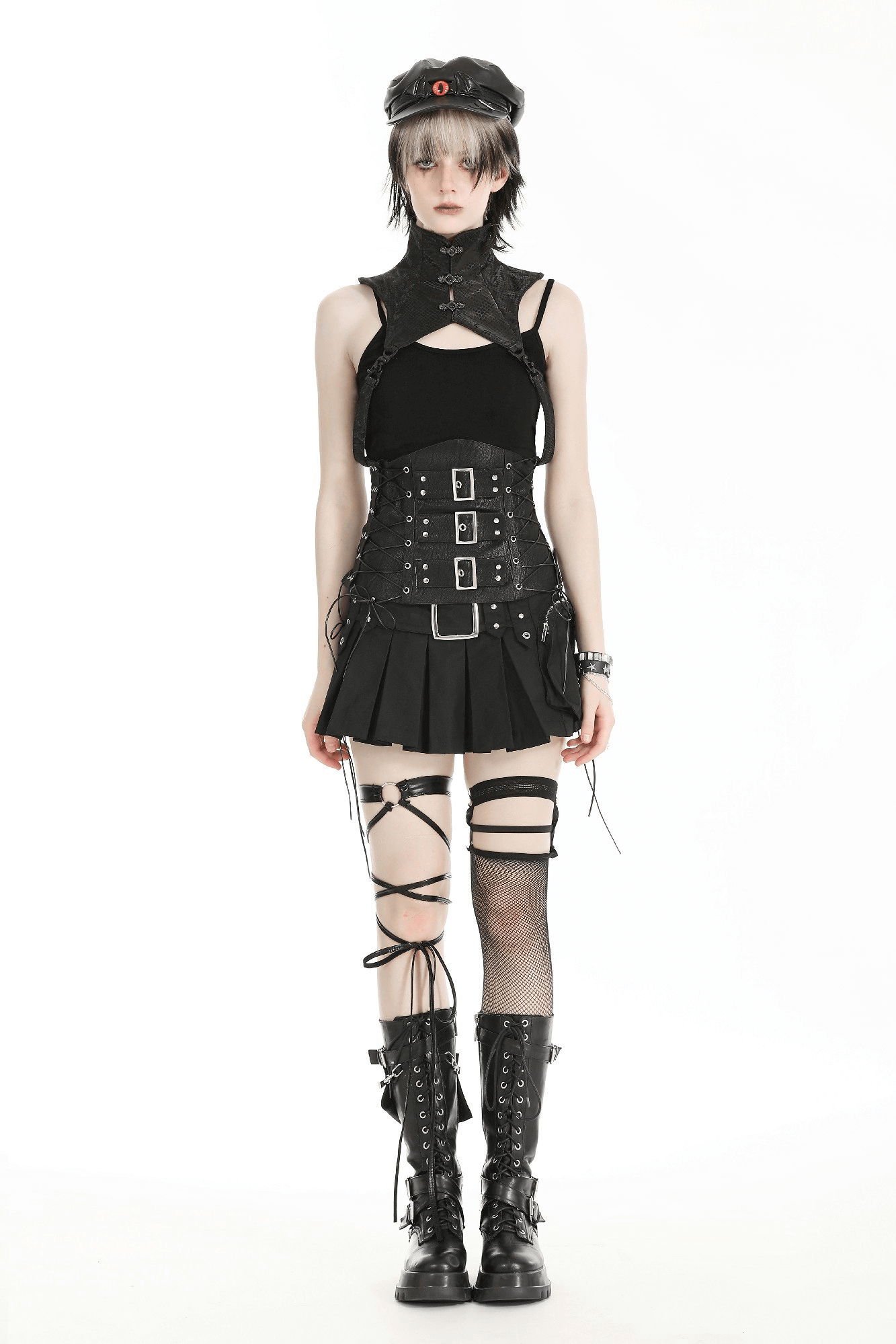 Fashionable model in edgy black outfit with high-neck collar, corset, and knee-high lace-up boots.