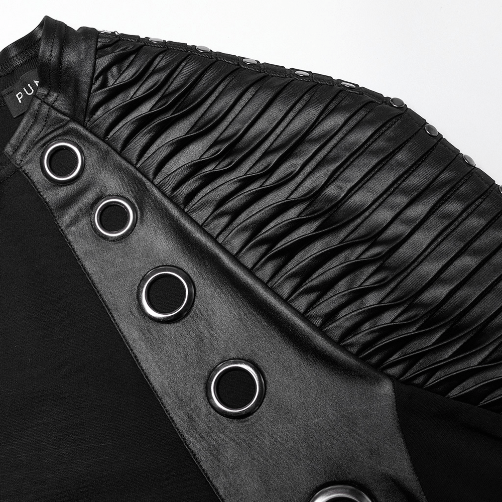 Close-up of black long-sleeved top featuring 3D pleats, leather accents, and rivet details for a punk-inspired look.