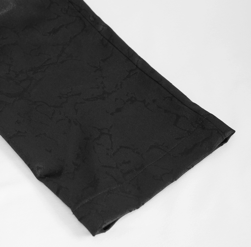 Close-up of black men's gothic pants showing stylish fabric texture and sleek fit for a vintage look.